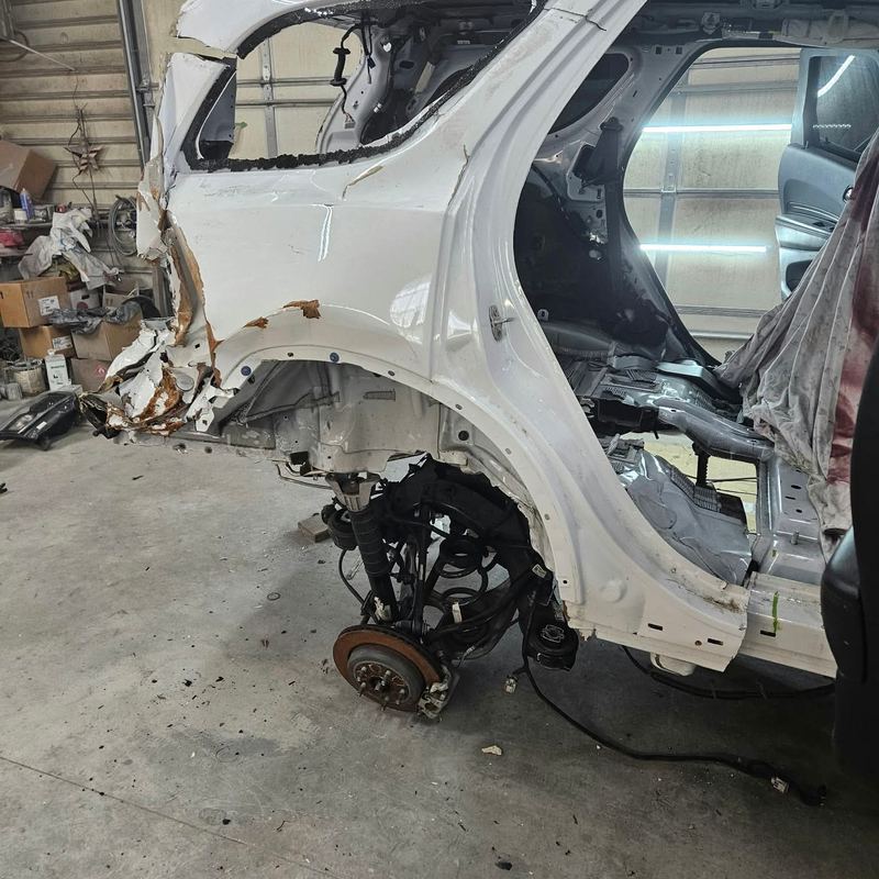 Damaged rear section cut away from a white SUV